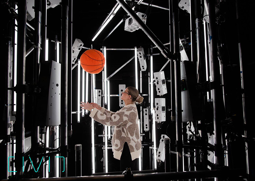 A person with a basketball in the volumetric capture studio